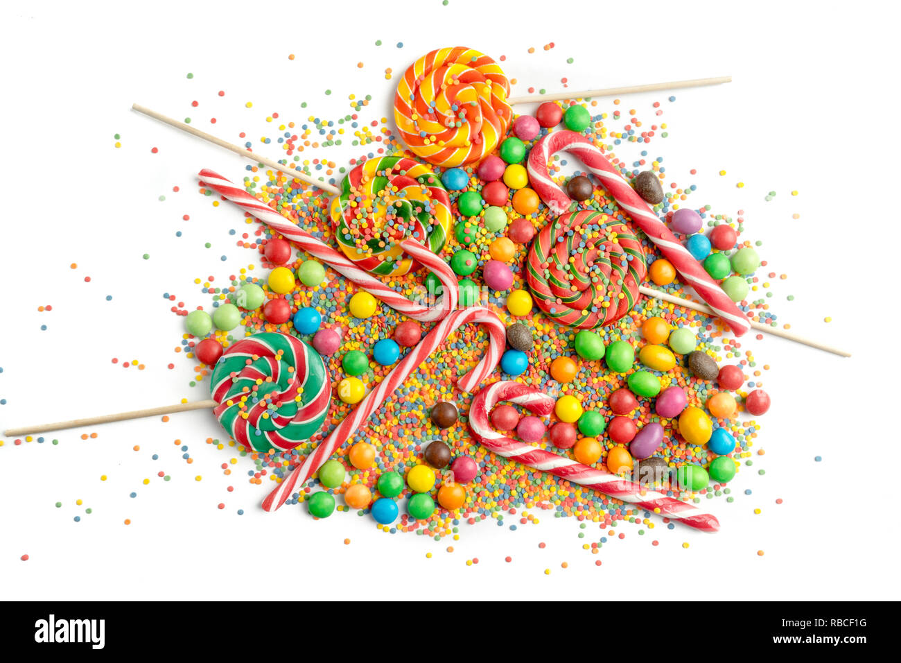 pile of colorful sweet candys on white background Stock Photo - Alamy