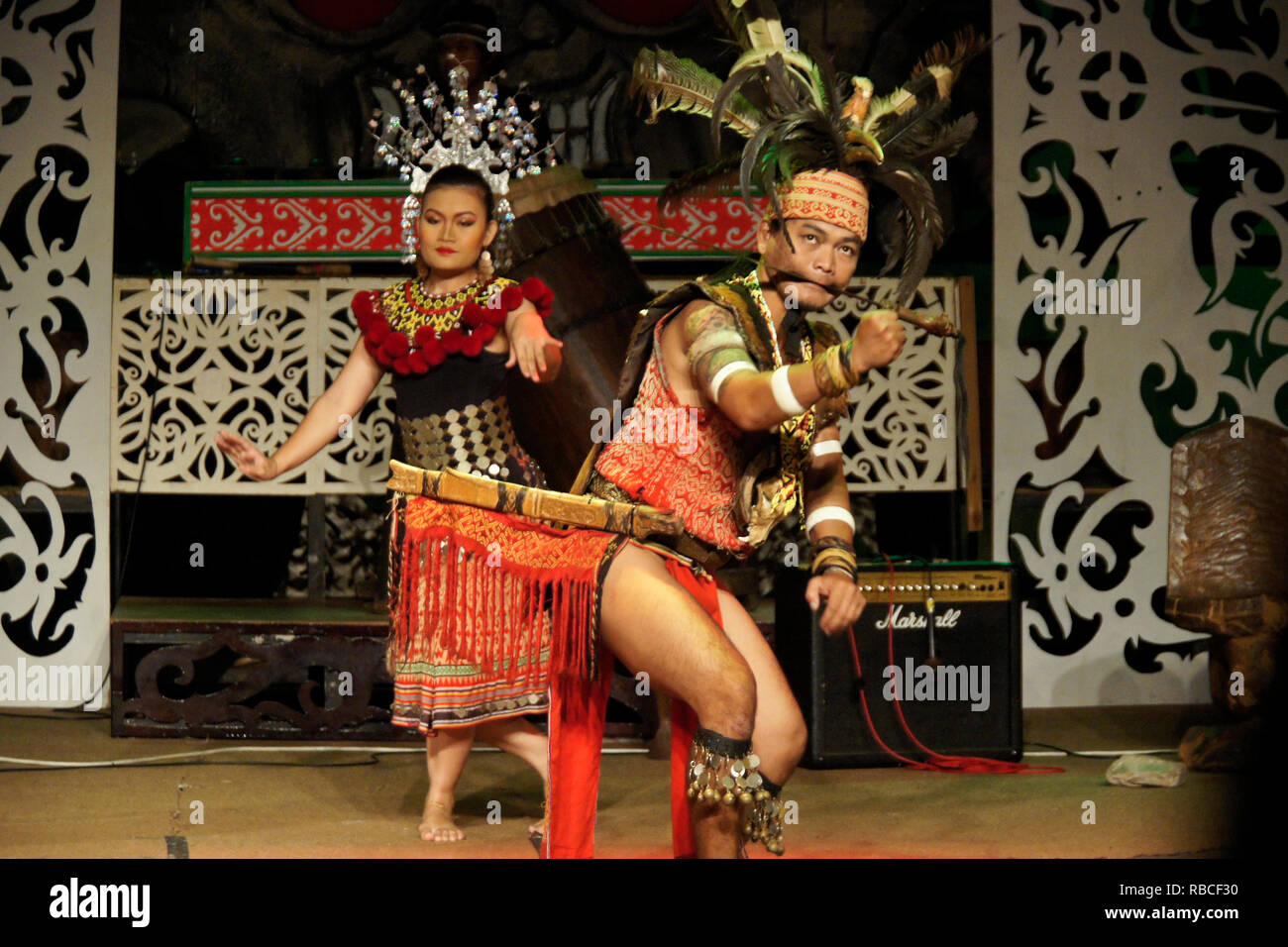 Iban tribal man and woman performing hornbill dance, Sarawak Cultural Village, Kuching, Sarawak (Borneo), Malaysia Stock Photo