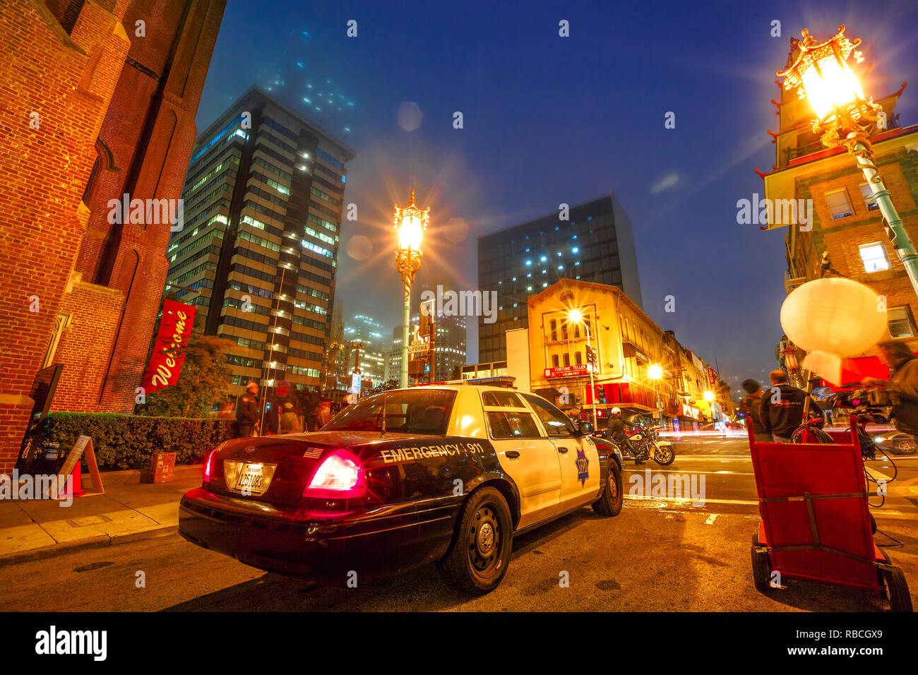 San Francisco, California, United States - August 16, 2016: film crew shooting a fake police car in Chinatown of San Francisco by night. Urban street view. Stock Photo