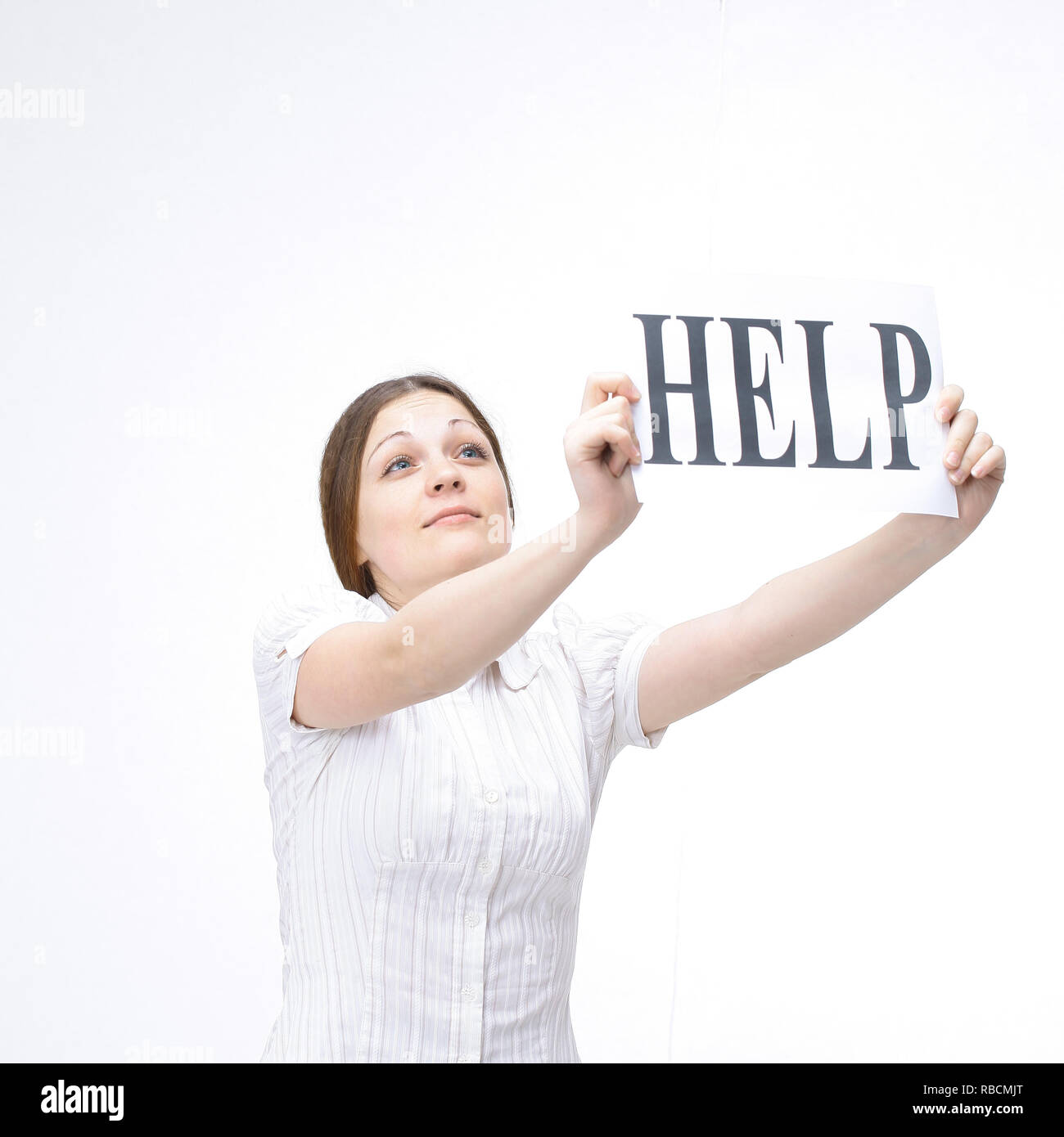 modern young woman showing a sheet that says HELP Stock Photo - Alamy