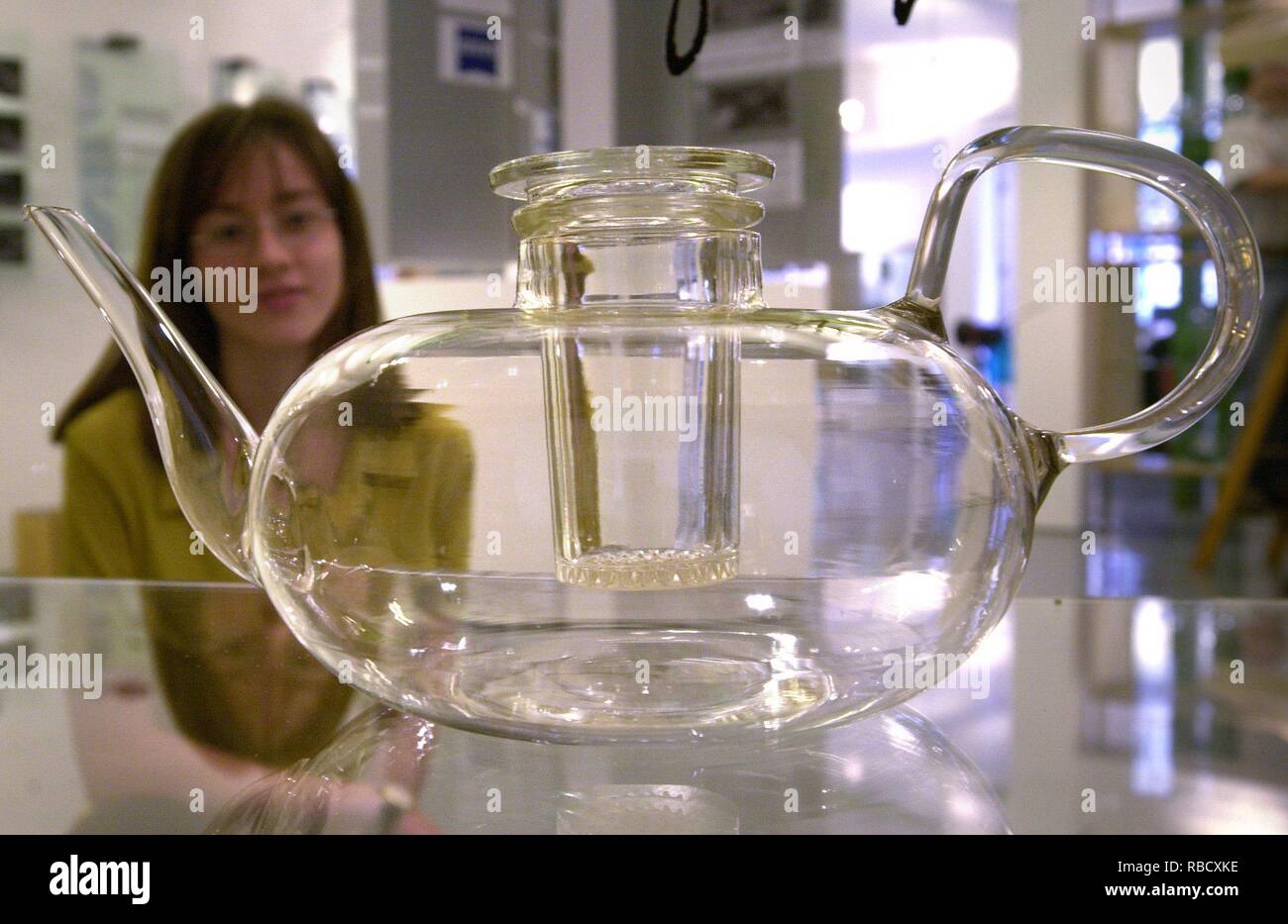 Jena (Thuringen): The famous teapot by Bauhaus designer Wilhelm Wagenfeld  is viewed on 29.08.2000 by a young woman in the Schott GlasMuseum in Jena,  which will be opened on 1 September 2000
