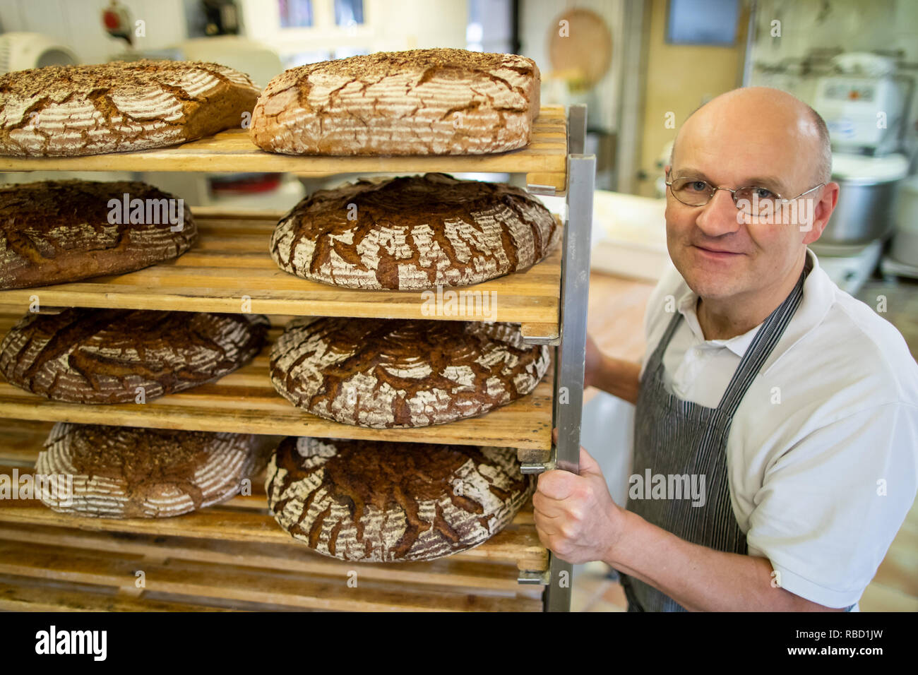 Dachsbach, Germany. 09th Jan, 2019. Arnd Erbel, master baker and confectioner and owner of the family bakery of the same name, drives a cart in the bakery of the Fränkisches Bauernbrot. Founded in the 17th century, the bakery has made a name for itself in the USA with bread, pretzels and gingerbread. Credit: Daniel Karmann/dpa/Alamy Live News Stock Photo