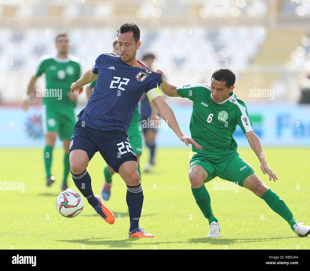 (190109) -- ABUZABI, Jan. 9, 2019 (Xinhua) --     Japan's Maya Yoshida (L) vies with Turkmenistan's Gurbangeldi Batyrov     during the 2019 AFC Asian Cup group F match between Japan and Turkmenistan at the Al Nahyan Stadium in Abu Dhabi, the United Arab Emirates, Jan. 9, 2019.     (Xinhua/Cao Can) Stock Photo