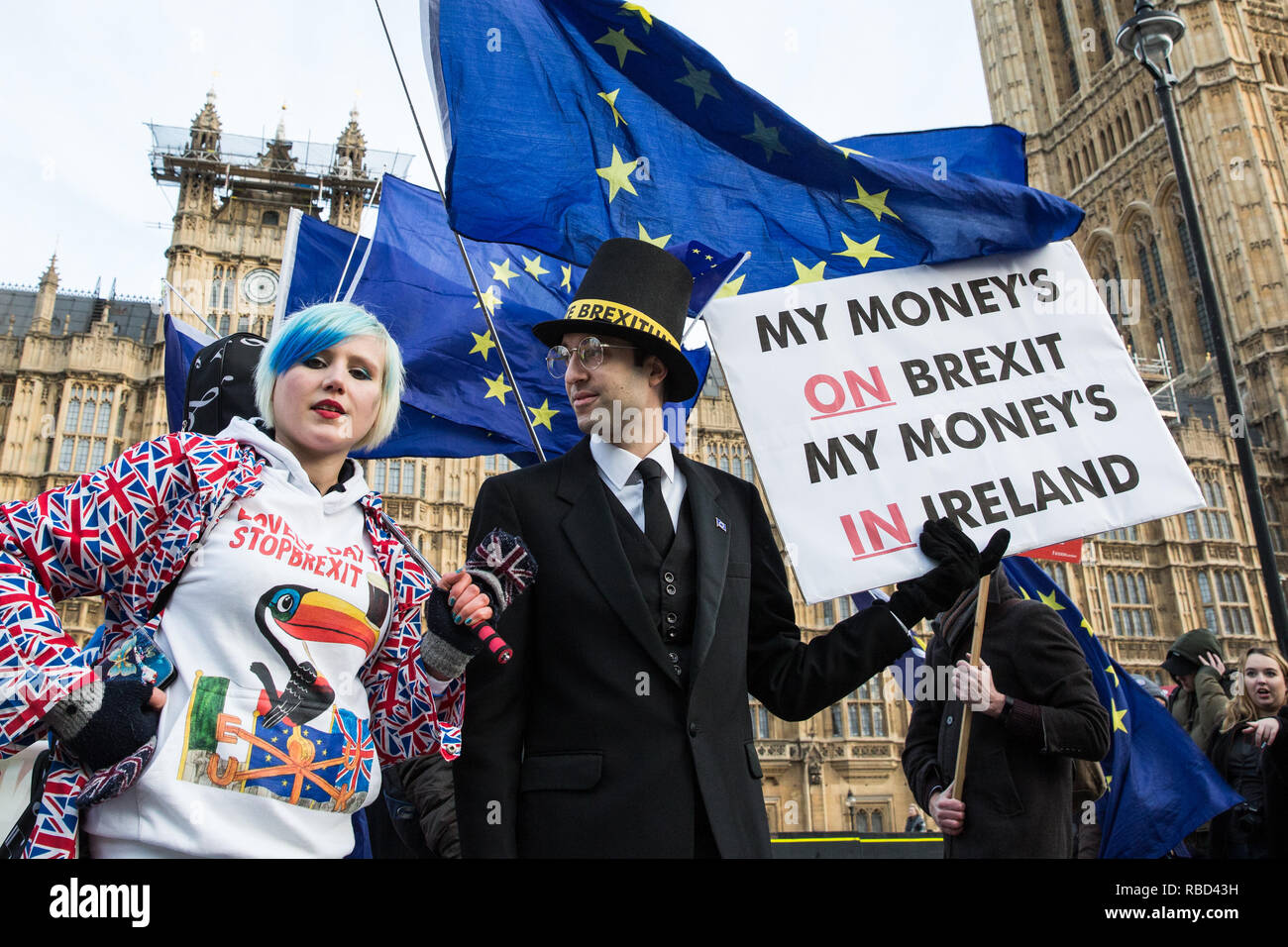 London, UK. 9th Jan, 2019. EU Supergirl Madeleina Kay stands with a fellow anti-Brexit activist disguised as Jacob Rees-Mogg and carrying a sign reading 'My Money's on Brexit My Money's in Ireland' during a protest by pro-EU group SODEM (Stand of Defiance European Movement) outside Parliament on the first day of the debate in the House of Commons on Prime Minister Theresa May's proposed Brexit withdrawal agreement. Credit: Mark Kerrison/Alamy Live News Stock Photo