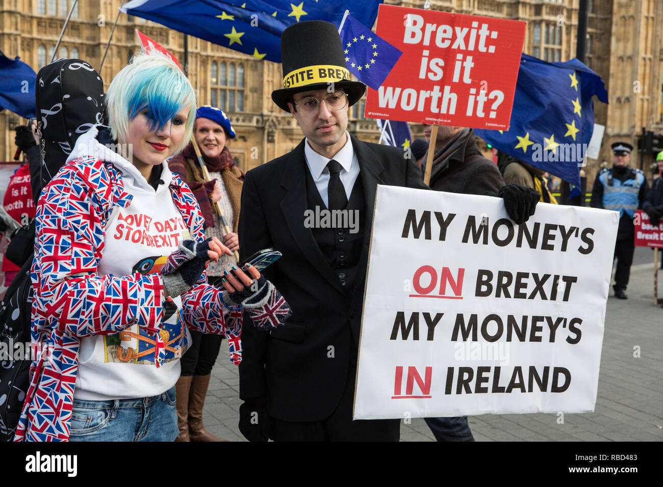 London, UK. 9th Jan, 2019. EU Supergirl Madeleina Kay stands with a fellow anti-Brexit activist disguised as Jacob Rees-Mogg and carrying a sign reading 'My Money's on Brexit My Money's in Ireland' during a protest by pro-EU group SODEM (Stand of Defiance European Movement) outside Parliament on the first day of the debate in the House of Commons on Prime Minister Theresa May's proposed Brexit withdrawal agreement. Credit: Mark Kerrison/Alamy Live News Stock Photo