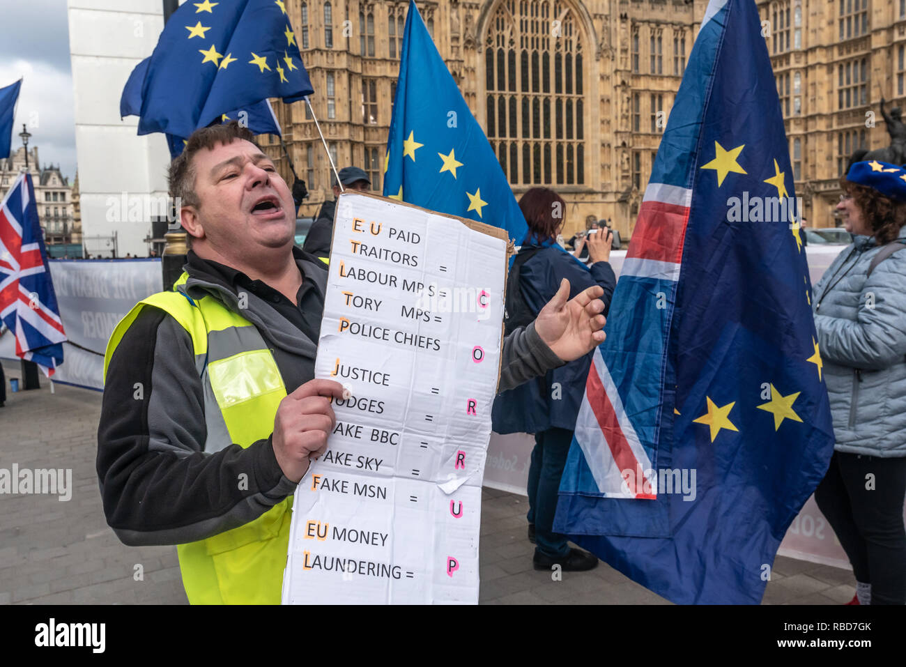 London, UK. 9th January 2019. Protests by stop Brexit group SODEM (Stand of Defiance European Movement) and pro-Brexit campaigners continue opposite Parliament. This man with a poster for the Guy Fawkes Movement promising civil war if we fail to leave the EU shouts insults at SODEM protesters, most of the other s in yellow jackets were fairly subdued. Most Brexiteers had come to support Brexit rather than cause trouble. Credit: Peter Marshall/Alamy Live News Stock Photo