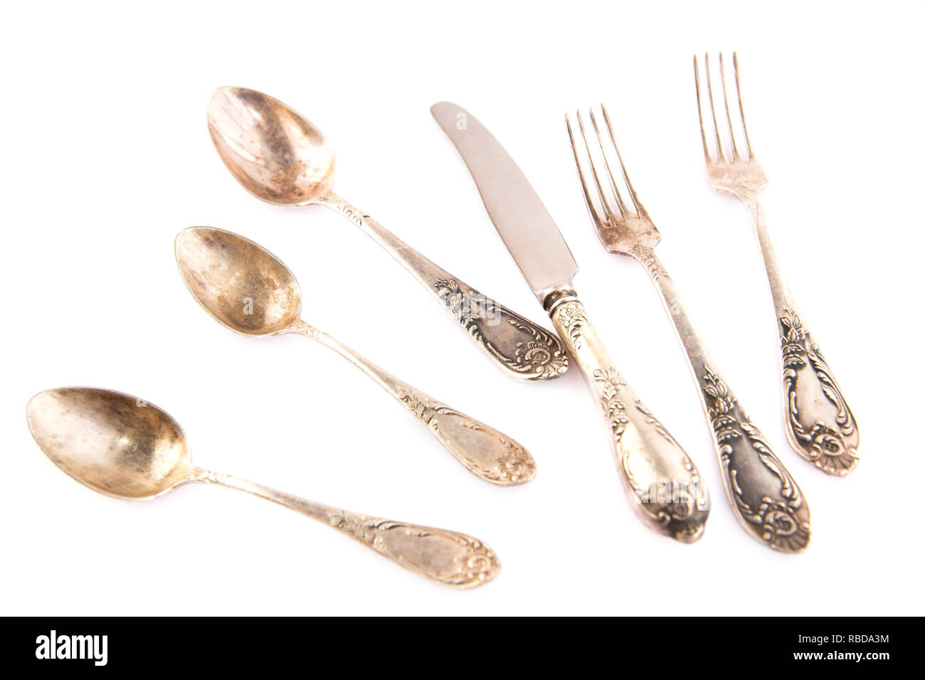 Vintage spoons, knife and forks isolated on white background Stock