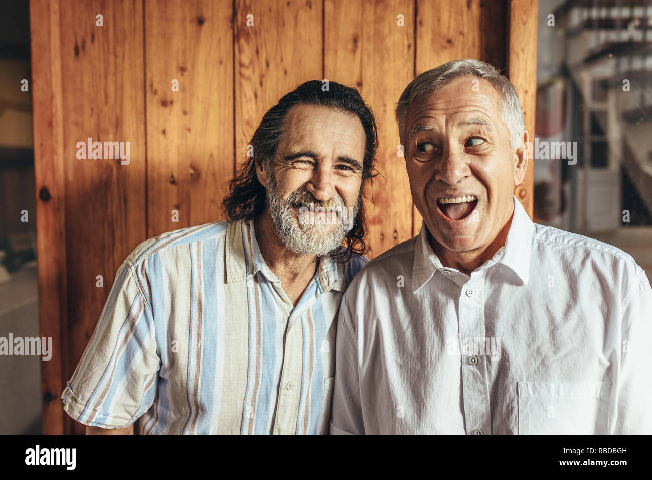 Two crazy senior friends standing together making funny faces. Retired men having fun together at home Stock Photo - Alamy Two crazy senior friends standing together making funny faces. Retired men having fun together at home Stock Photo - Alamy
