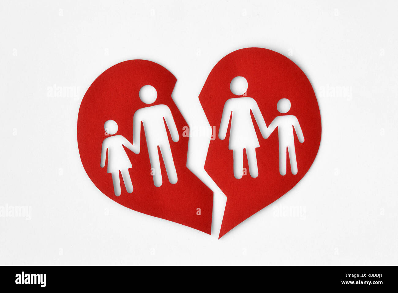 Paper broken heart with a family - Divorce and broken family concept Stock Photo
