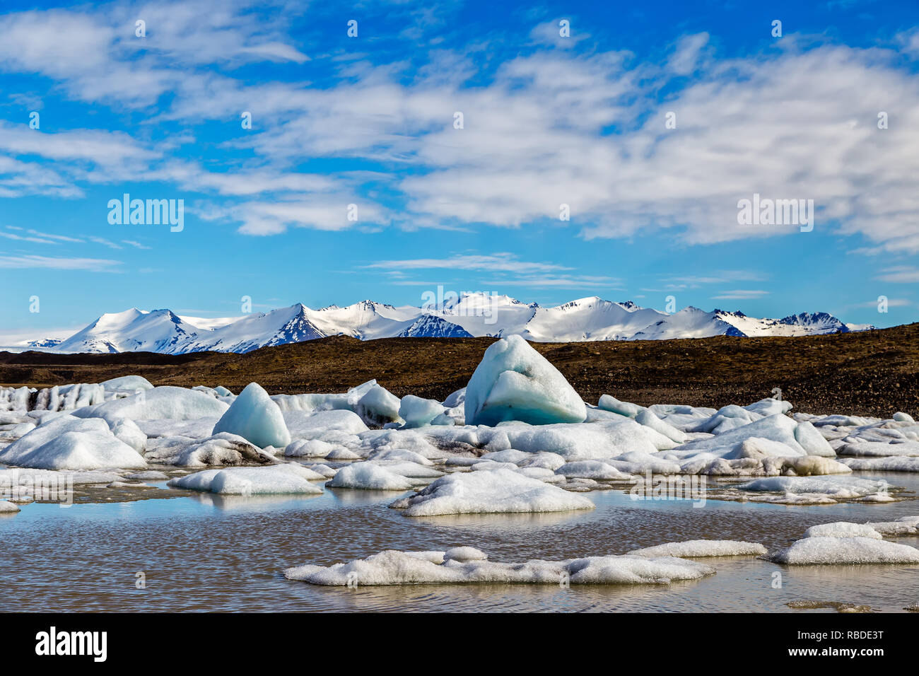 Fjallsarlon is a glacial lake at the southern end of the Iclandic glacier Vetnajökull. The many icebergs in the lake are prticularty attractive. Stock Photo