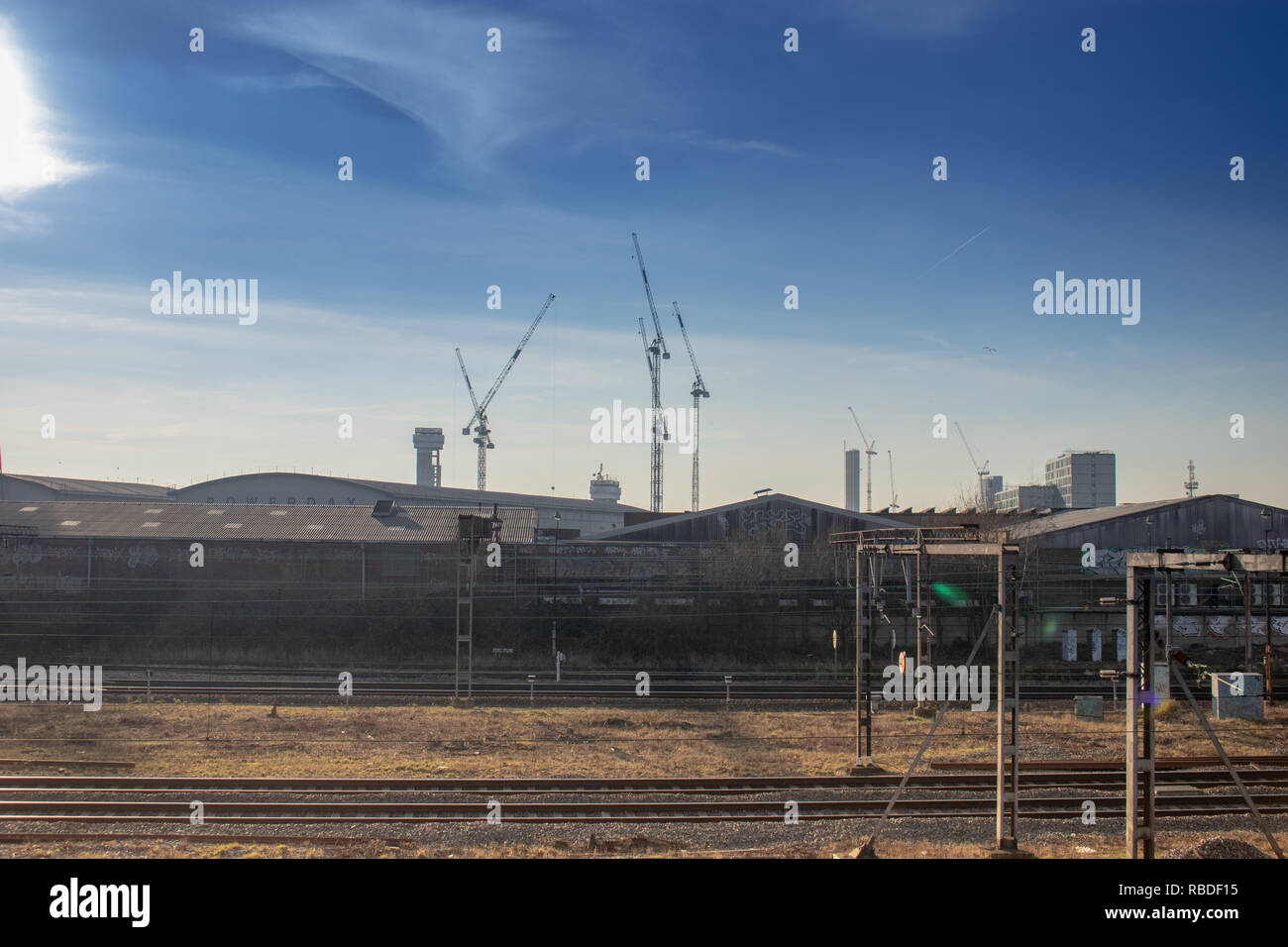 Cranes and Skyline at Willesden Junction/Rail Depot Stock Photo