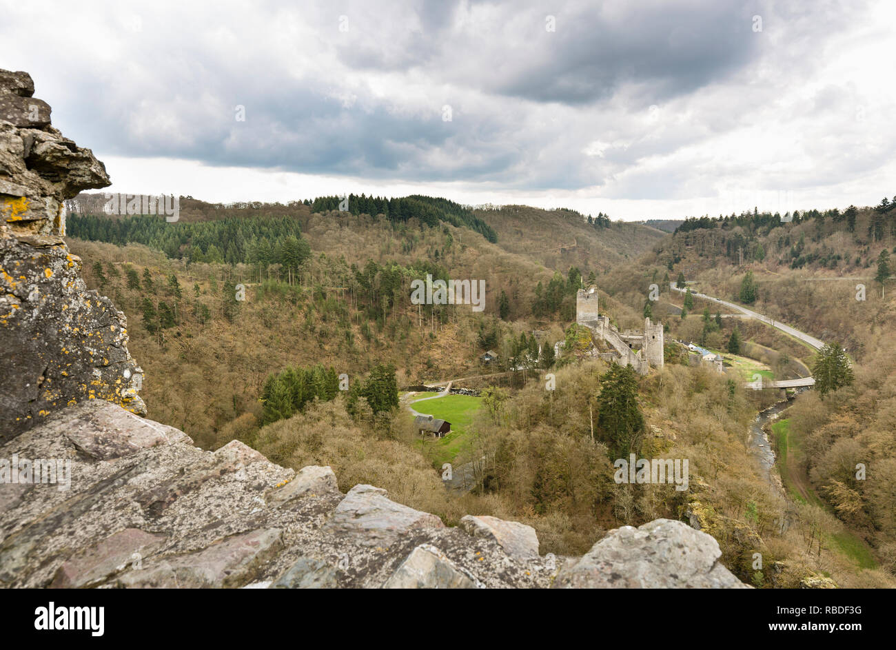 Lieser valley and the castle ruin of the Niederburg Manderscheid in the Eifel, Germany in spring seen from the Oberburg. Stock Photo