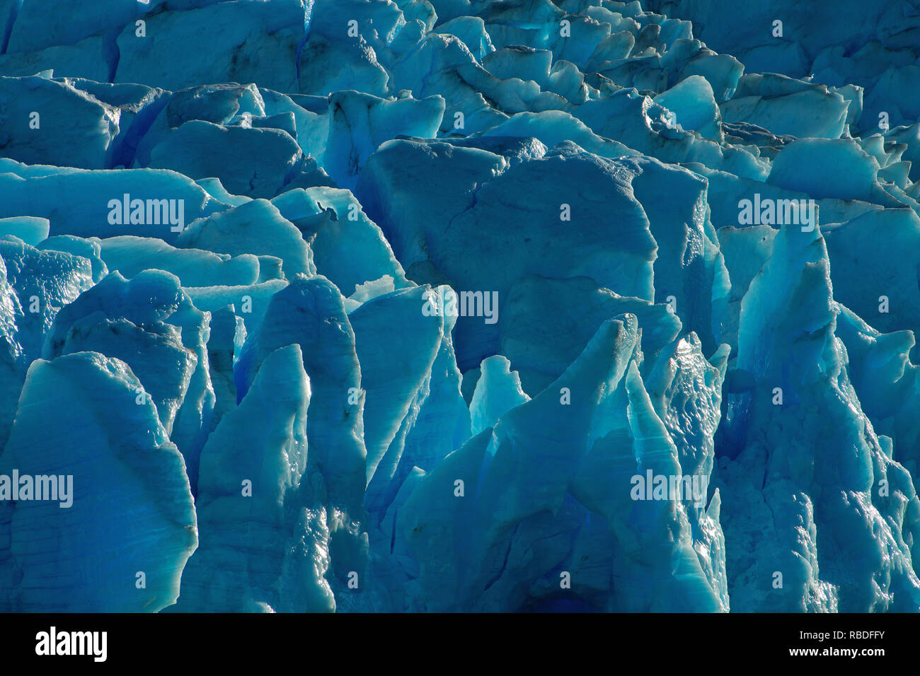 Rim light on a glacier in Los Glaciares National Park in Chile. Stock Photo