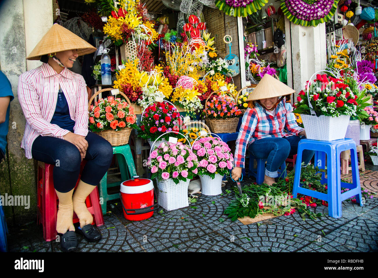 Vietnamese flower sellers at Ben Thanh Market in Saigon, Vietnam Stock