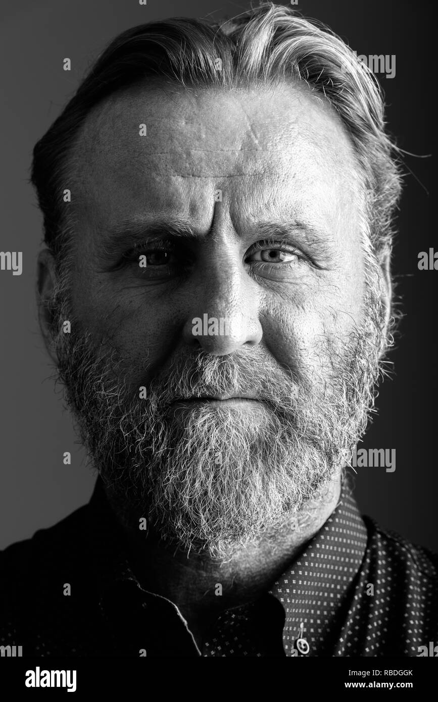 Face of mature bearded man in black and white Stock Photo