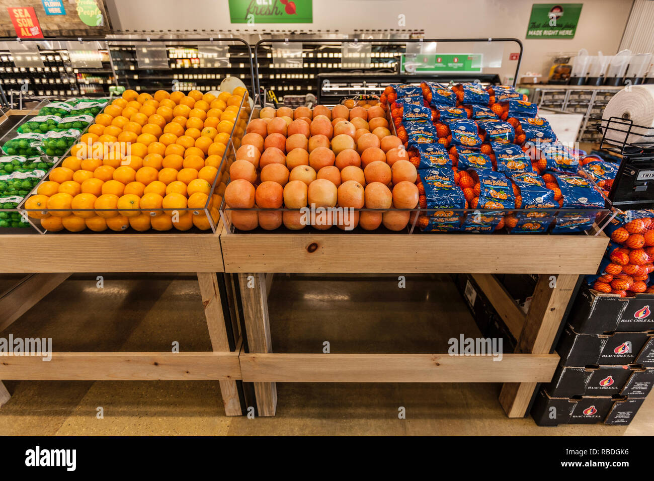 Fruit Stand of Oranges, Grapefruit, Limes At Market Stock Photo