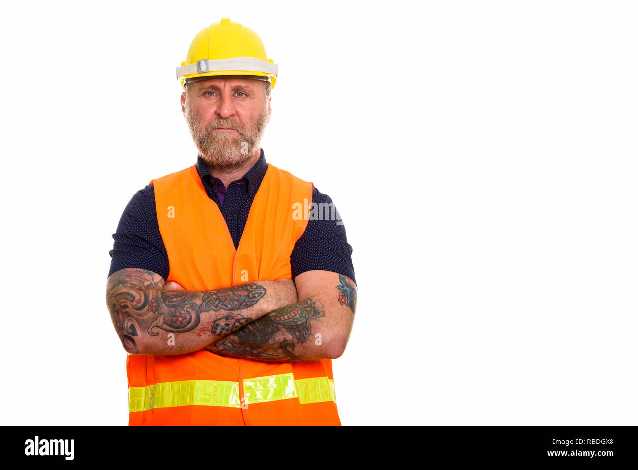Mature bearded man construction worker with hand tattoos with ar Stock Photo