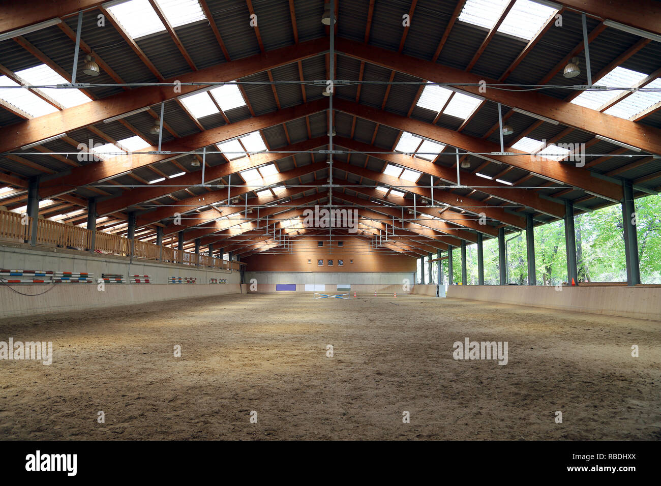 View in an indoor riding hall for horses and riders. The riding school is suitable for dressage and jumping  horses Stock Photo