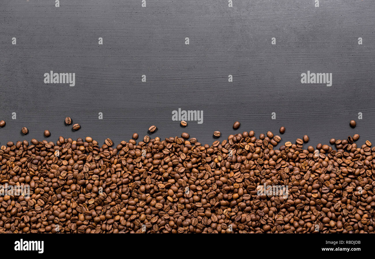 Coffee beans frame on black table Stock Photo