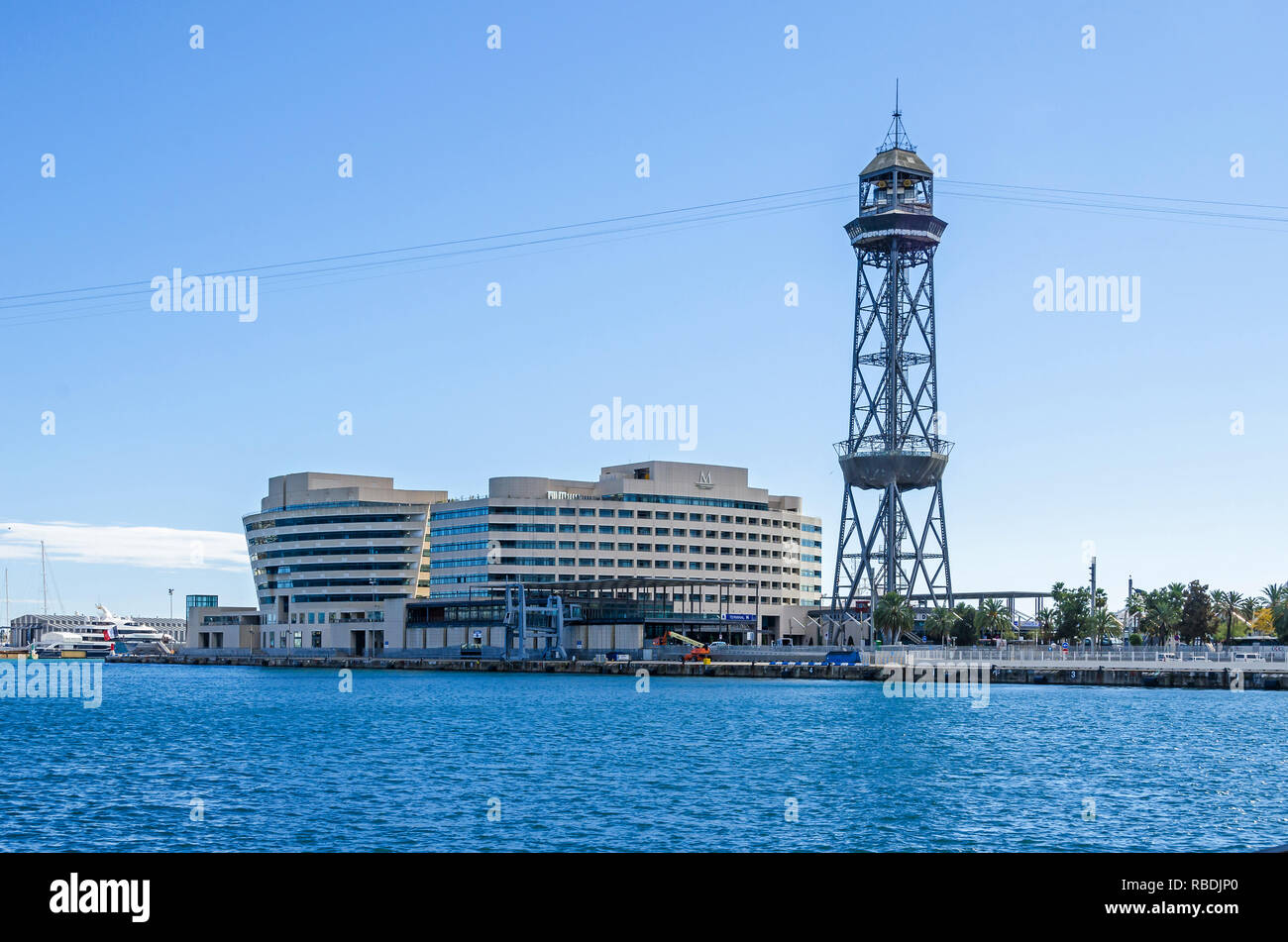 Barcelona, Spain - November 10, 2018: Barcelona Cruise Port with its steel truss tower of the aerial tramway Torre Jaume I, the World Trade Center Stock Photo