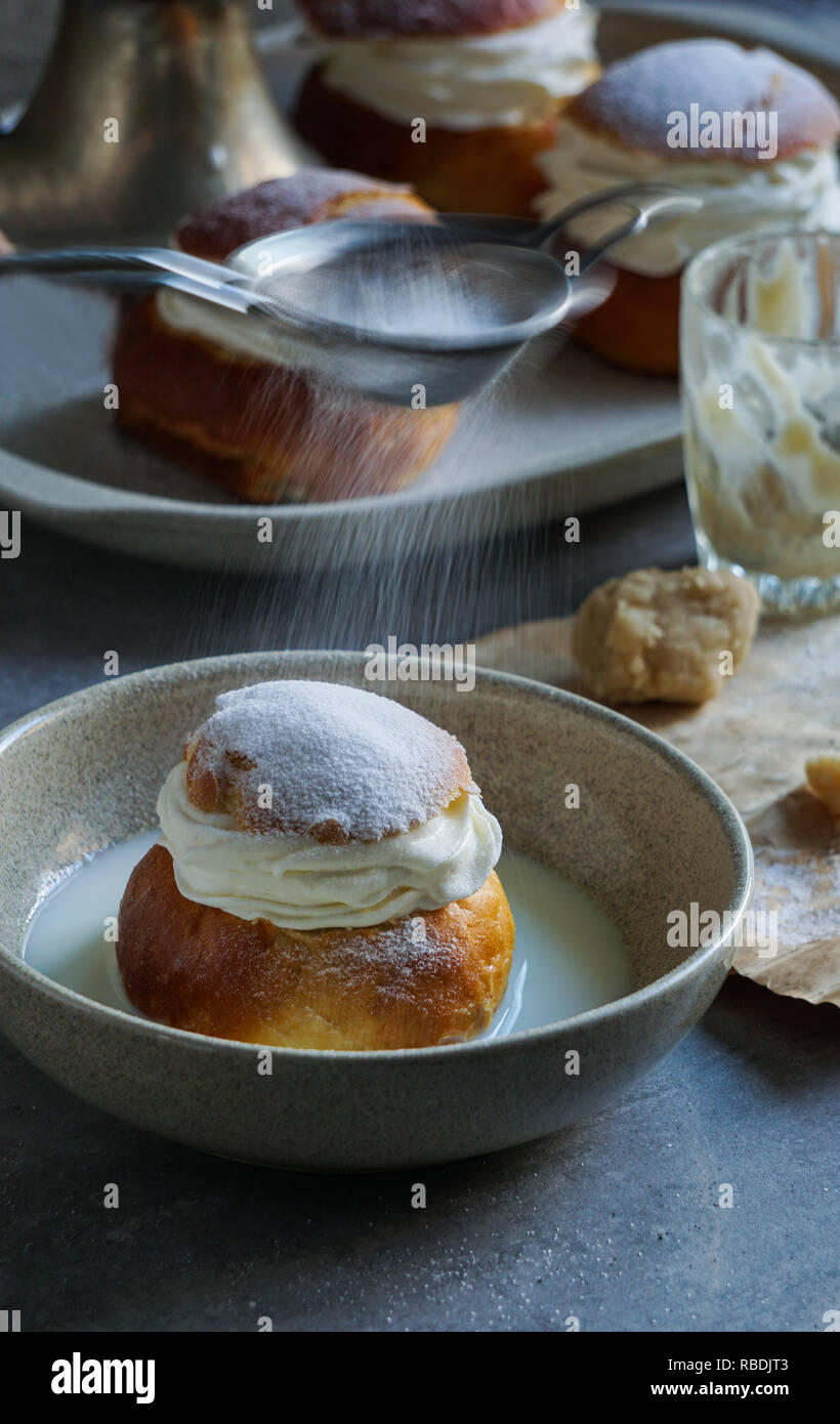 Semla or semlor, vastlakukkel, laskiaispulla is a traditional sweet roll made in various forms in Sweden, Finland, Estonia, Norway, Denmark, especially Shrove Monday and Shrove Tuesday Stock Photo