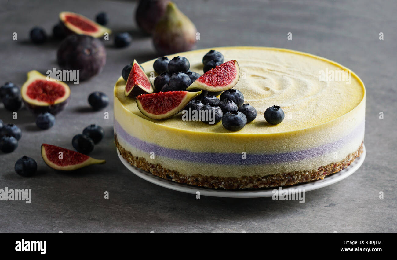 Vegan raw cheesecake with blueberry and figs, cashew cream, coconut