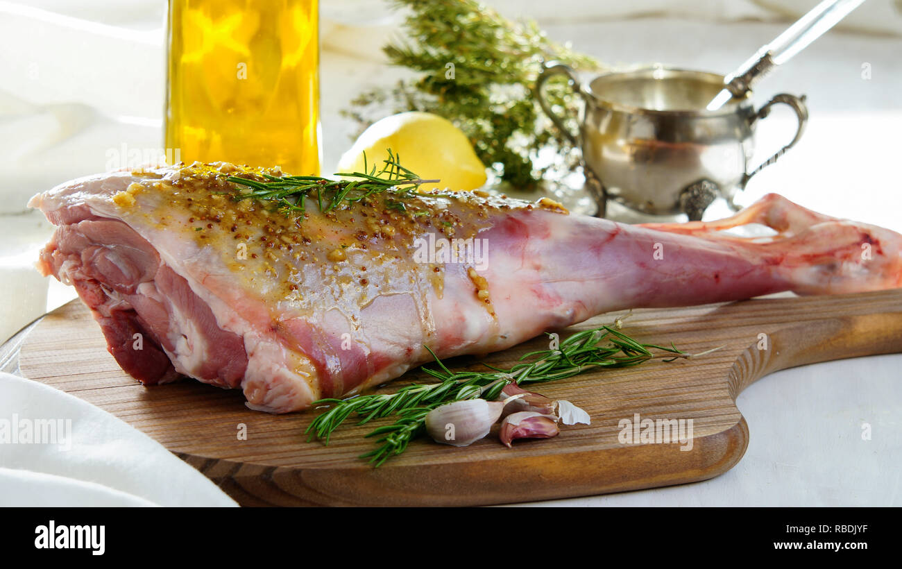 lamb leg raw with olive oil and mustard seeds marinade Stock Photo Alamy