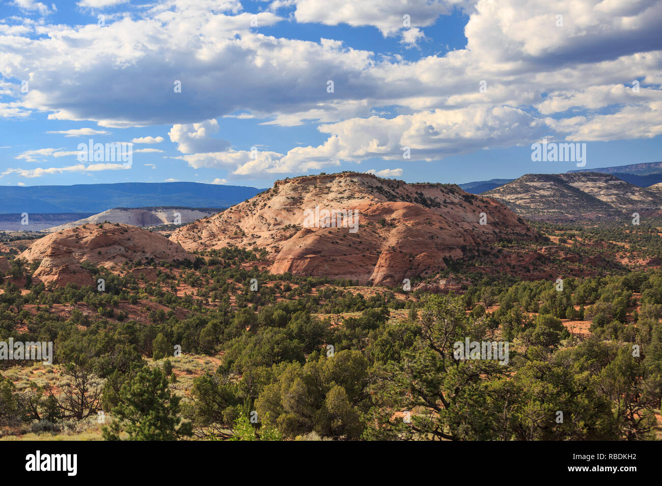 view of the red rock landscape, with blue sky and puffy white clouds, from the Escalante Grand Staircase region in Southern Utah Stock Photo