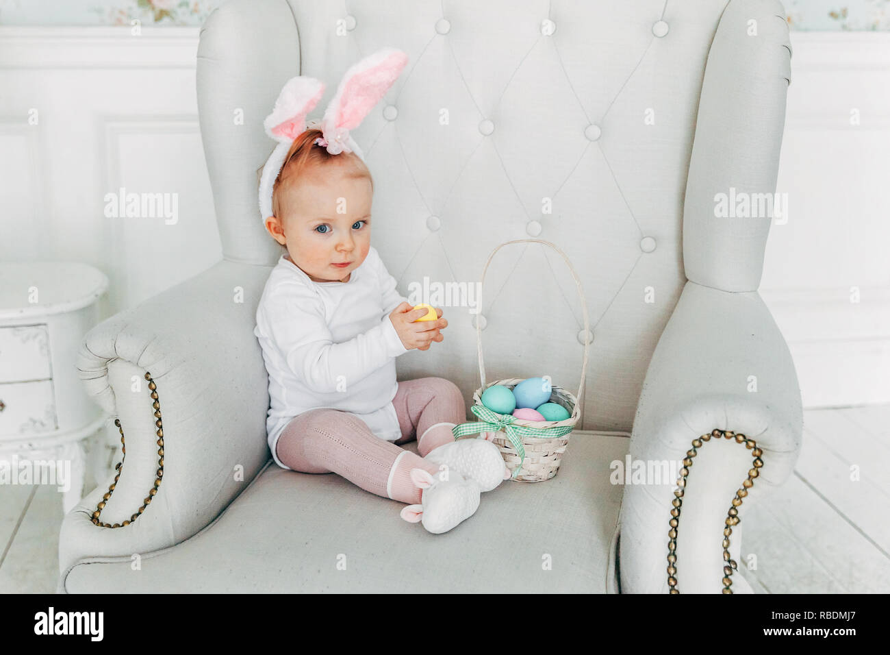 Little Child Girl Wearing Bunny Ears On Easter Day Girl Holding