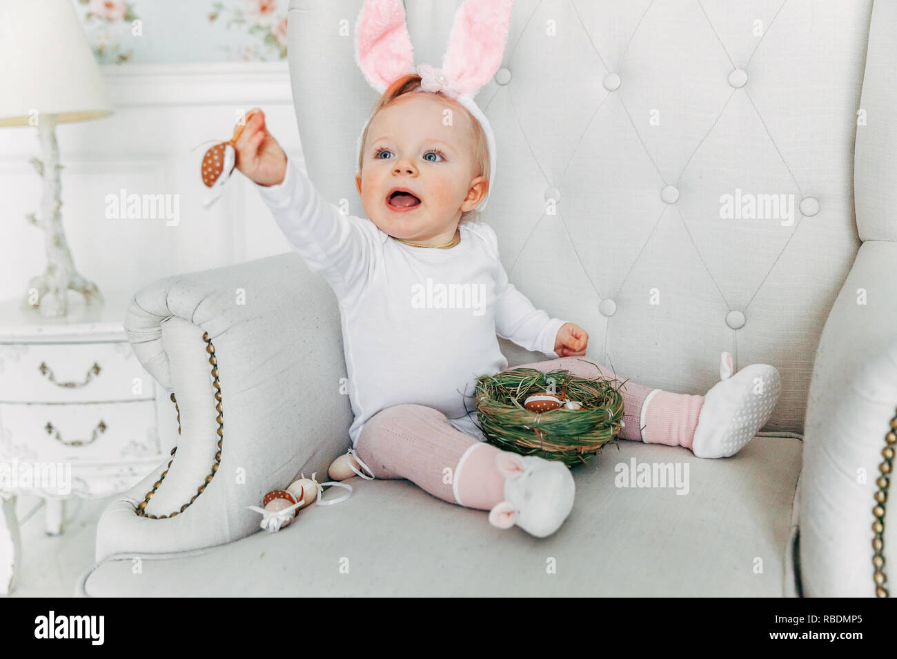 Little Child Girl Wearing Bunny Ears On Easter Day Girl Holding