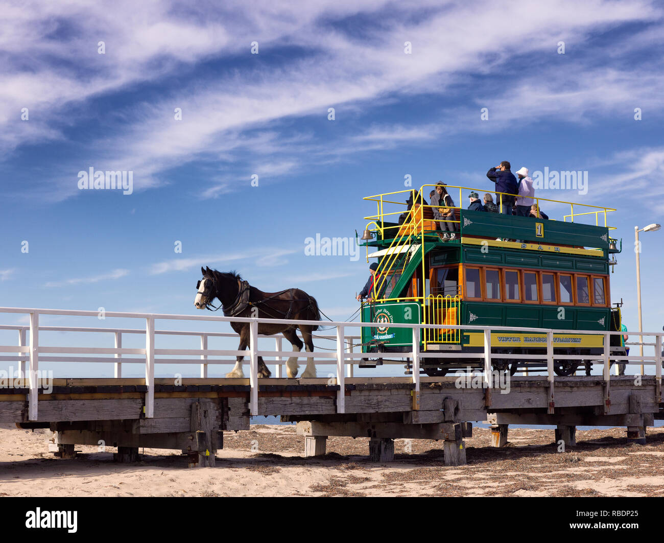 Historic horse-drawn tram crossing the 600-metre causeway from Victor Harbor to Granit Island Stock Photo