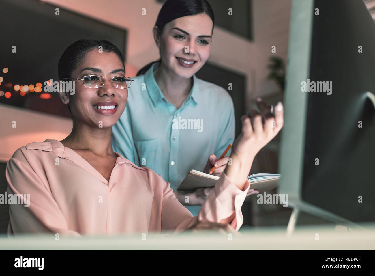 Plan discussion. Amazing assistant keeping smile on her face while ...