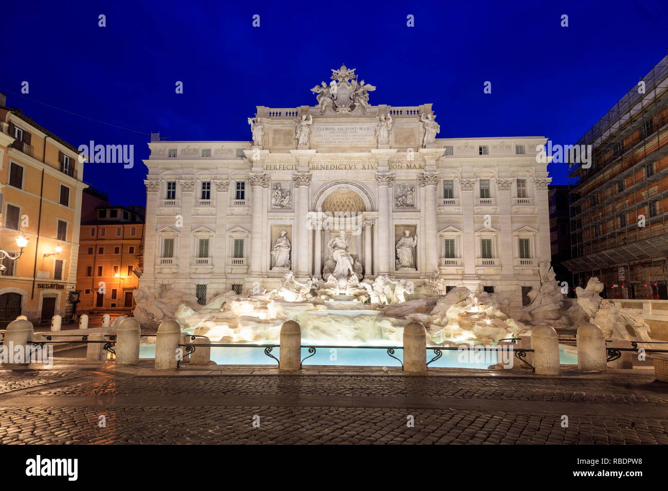 View of Trevi Fountain illuminated by street lamps and the lights of dusk Rome Lazio Italy Europe Stock Photo