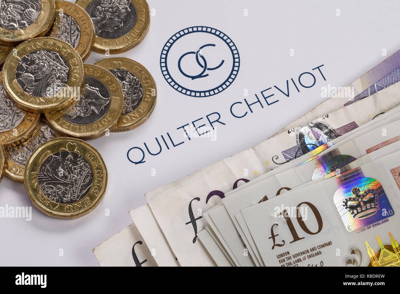 A Quilter Cheviot logo with some cash Stock Photo