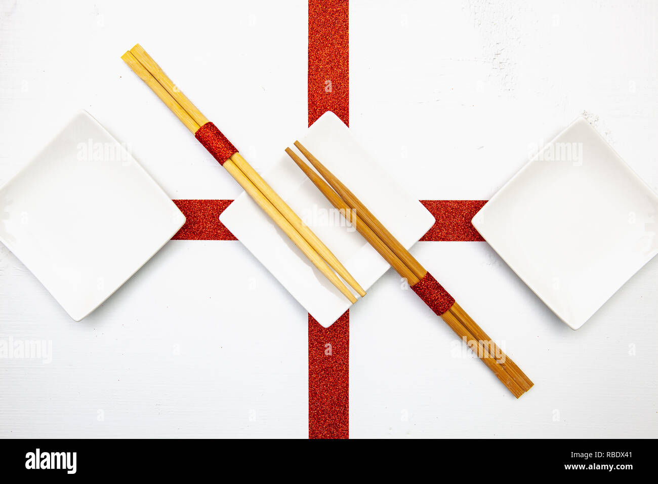 Ceramic Bowls And Bamboo Chopsticks For Sushi Food With Red And