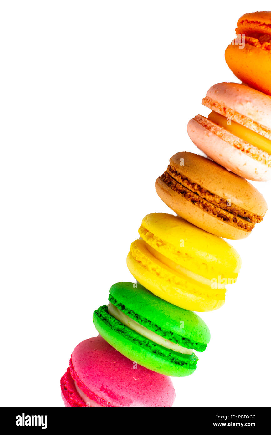 Colorful french macaroons tower isolated on white background Stock Photo