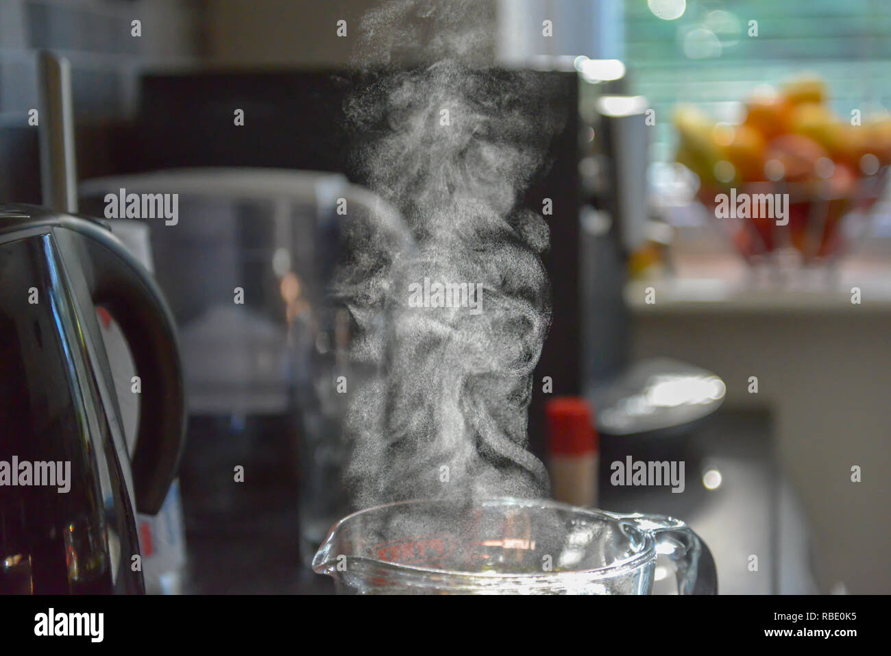 Steam coming out of water jug Stock Photo