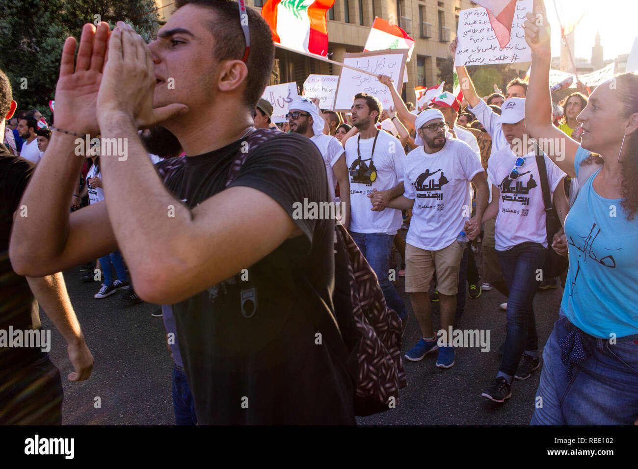 People with flags of Lebanon went on a protest against trash crisis. Arabic spring protest in Beirut, Lebanon Stock Photo