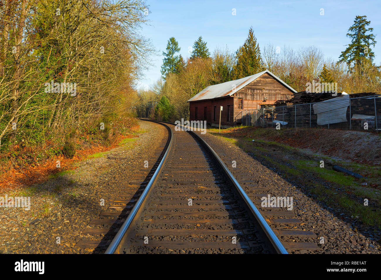 Roadroad train track in historic antique district in Aurora Oregon on a sunny clear blue sky afternoon Stock Photo