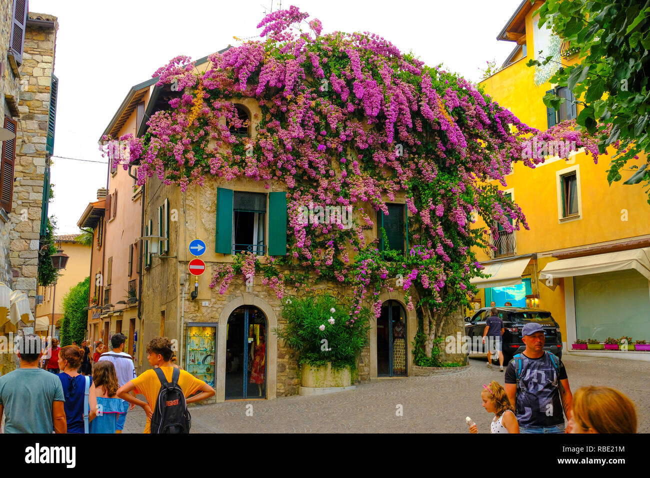 Sirmione, Italy - August 09, 2018: People are walking on colorful streets of Sirmione Italian town on Garda Lake. Italy Stock Photo