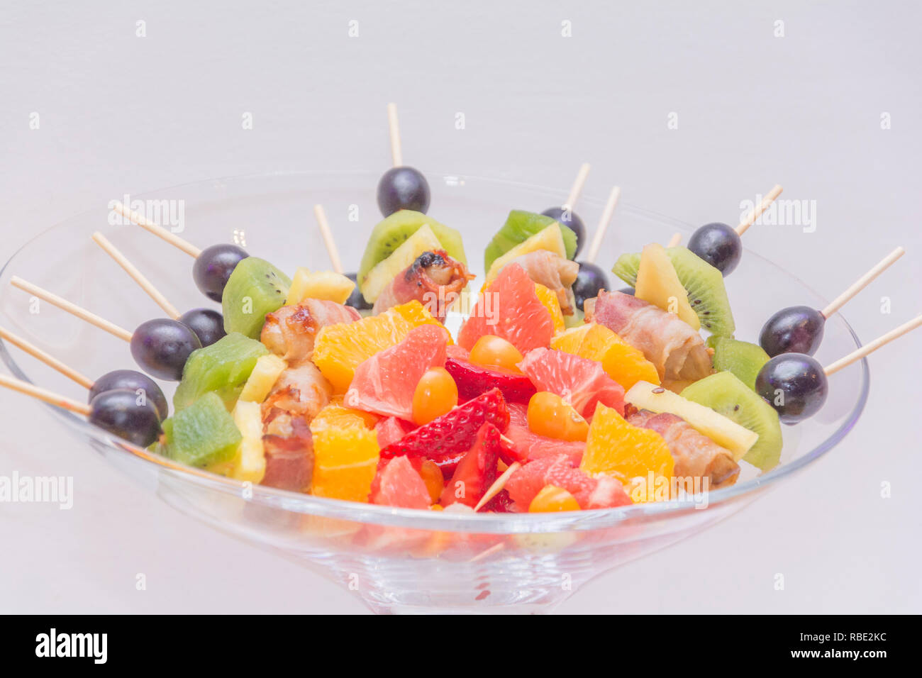 Fresh fruit-kiwi,orange, grapes, strawberries Stock Photo