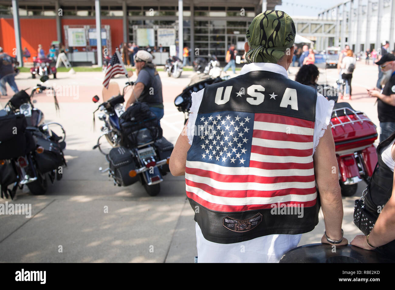 A motorcyclist with a USA vest attends the 115th Harley-Davidson anniversary event at the Harley-Davidson Museum in Milwaukee, Wisconsin Stock Photo