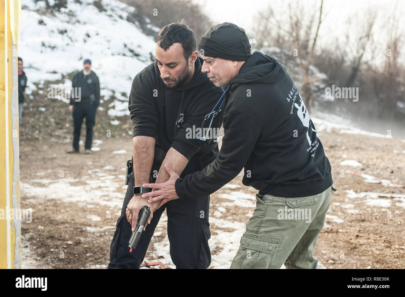 Pozarevac, Serbia - December 21-24, 2018: Kapap Instructor Avi Nardia teaches his students on the shooting range GROM, how to safely use the gun on KA Stock Photo
