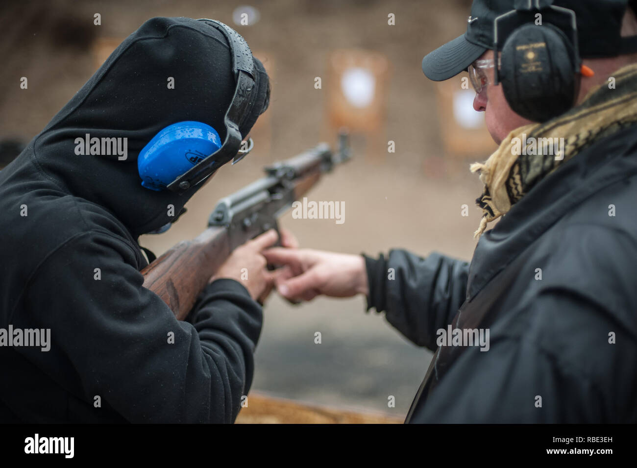 Pozarevac, Serbia - December 21-24, 2018: Instructor Zeljko Vujicic teaches his students on shooting range GROM, how to safely use Kalashnikov rifle o Stock Photo