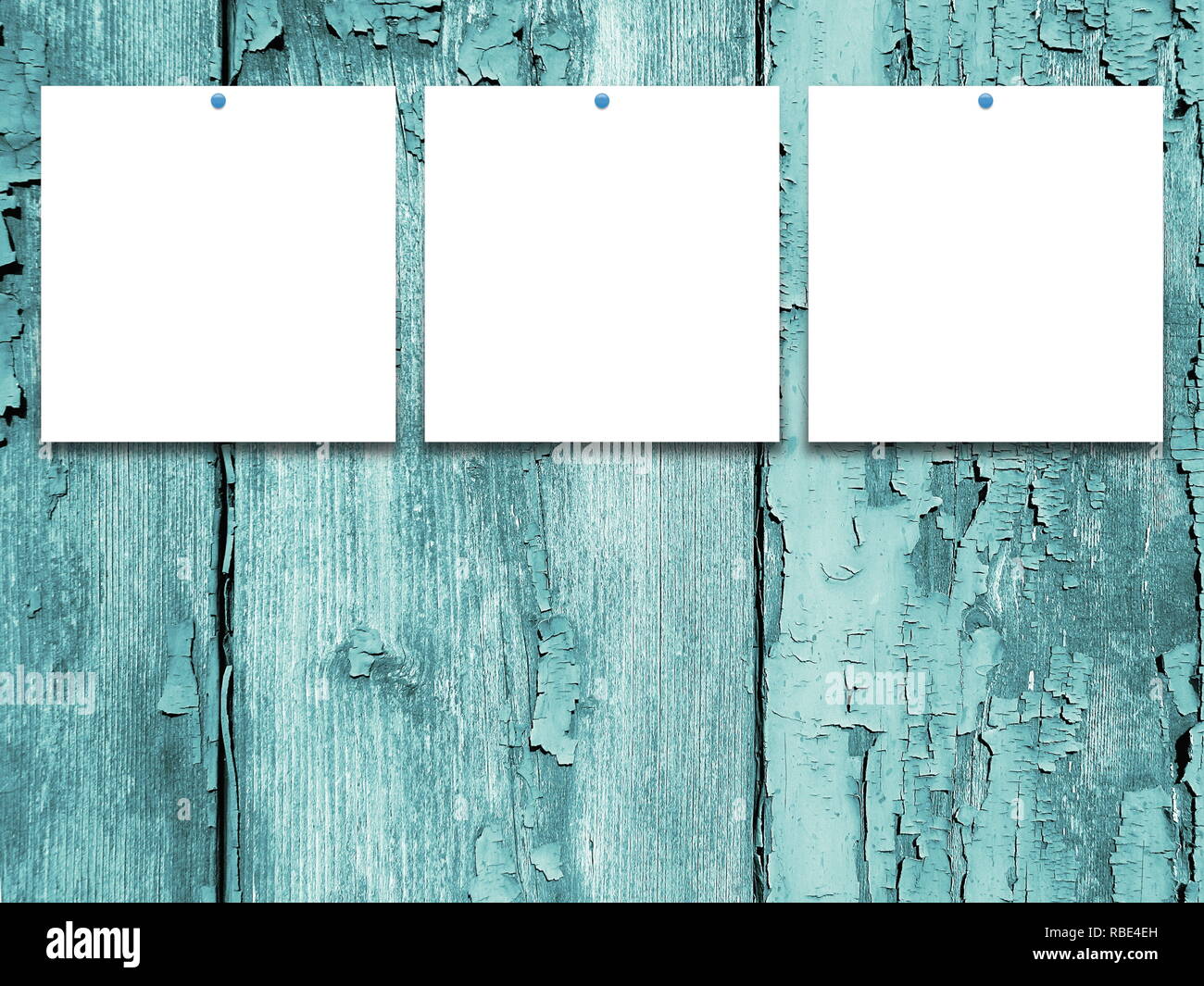 Three square blank frames on aqua weathered wooden background Stock Photo