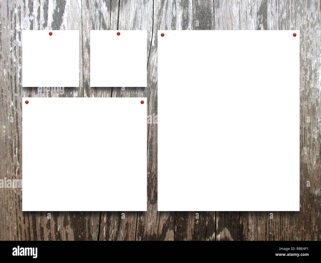 Four square and rectangular blank frames on brown wooden plank background Stock Photo