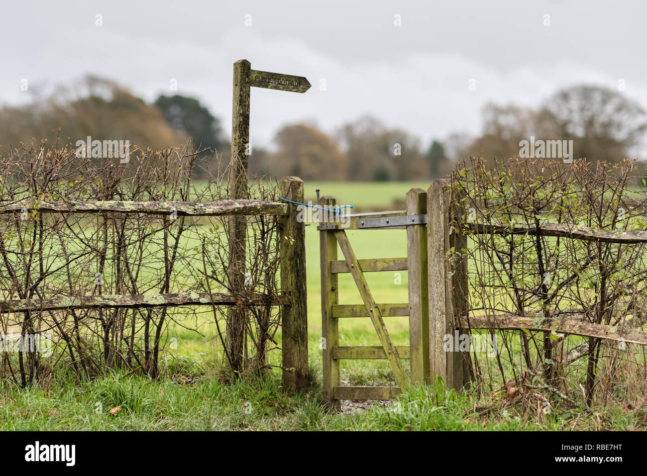 Signpost and gate on a public footpath in a rural part of Mid Sussex Stock Photo