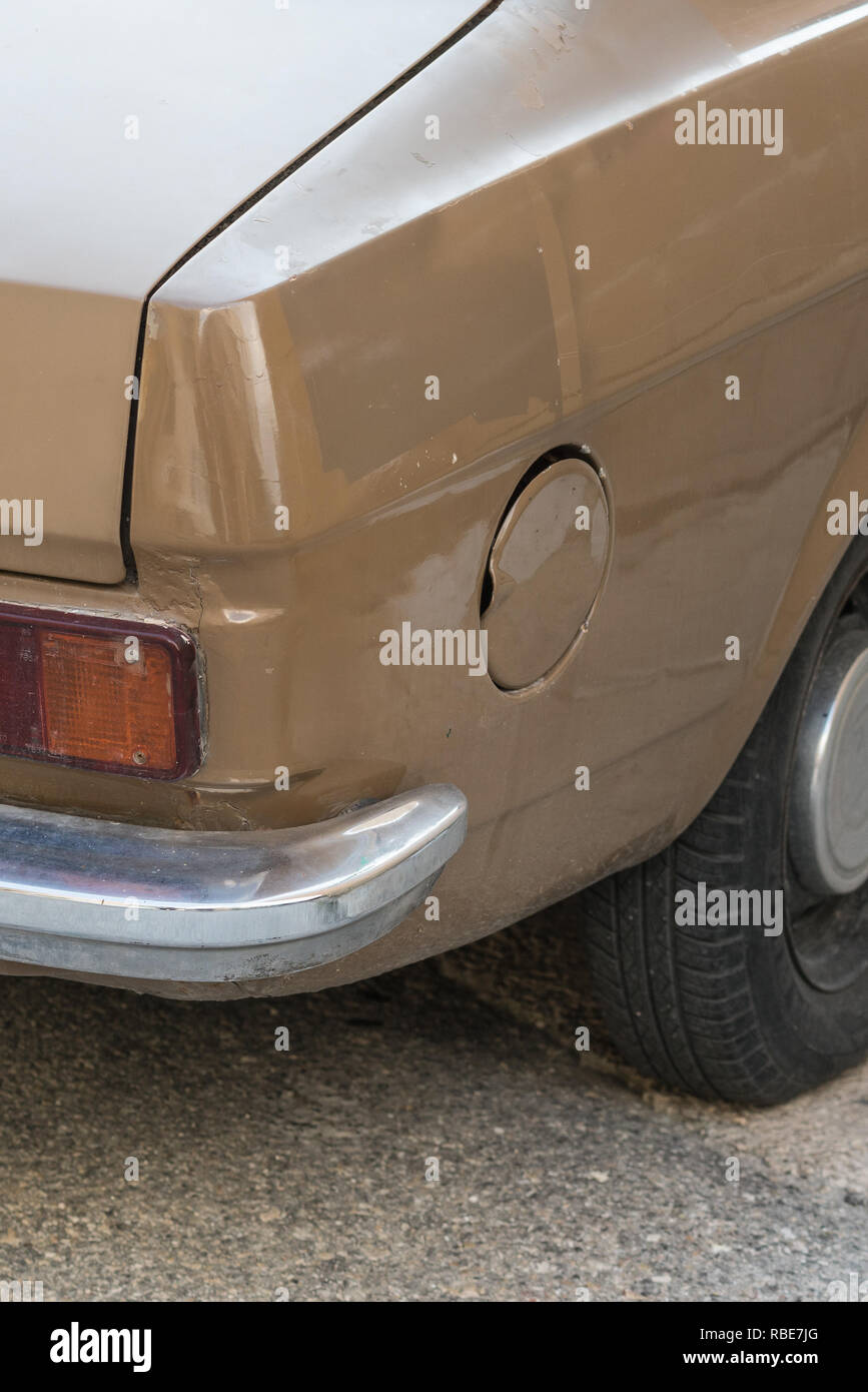 Close up of the petrol cap, bumper and rear end of a vintage car in Malta Stock Photo