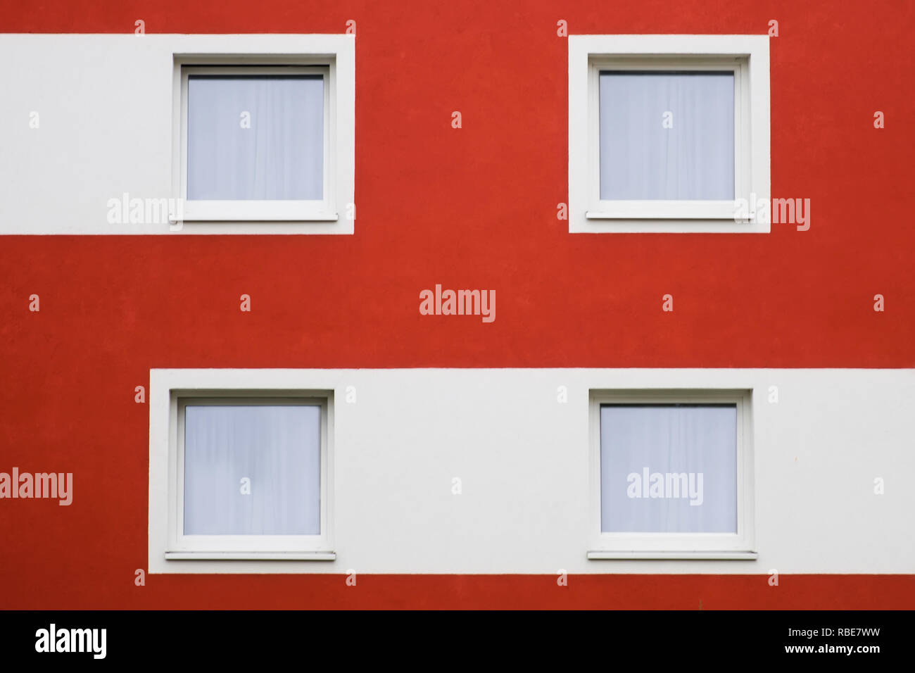 Residential home with modern red and white facade painting Stock Photo ...
