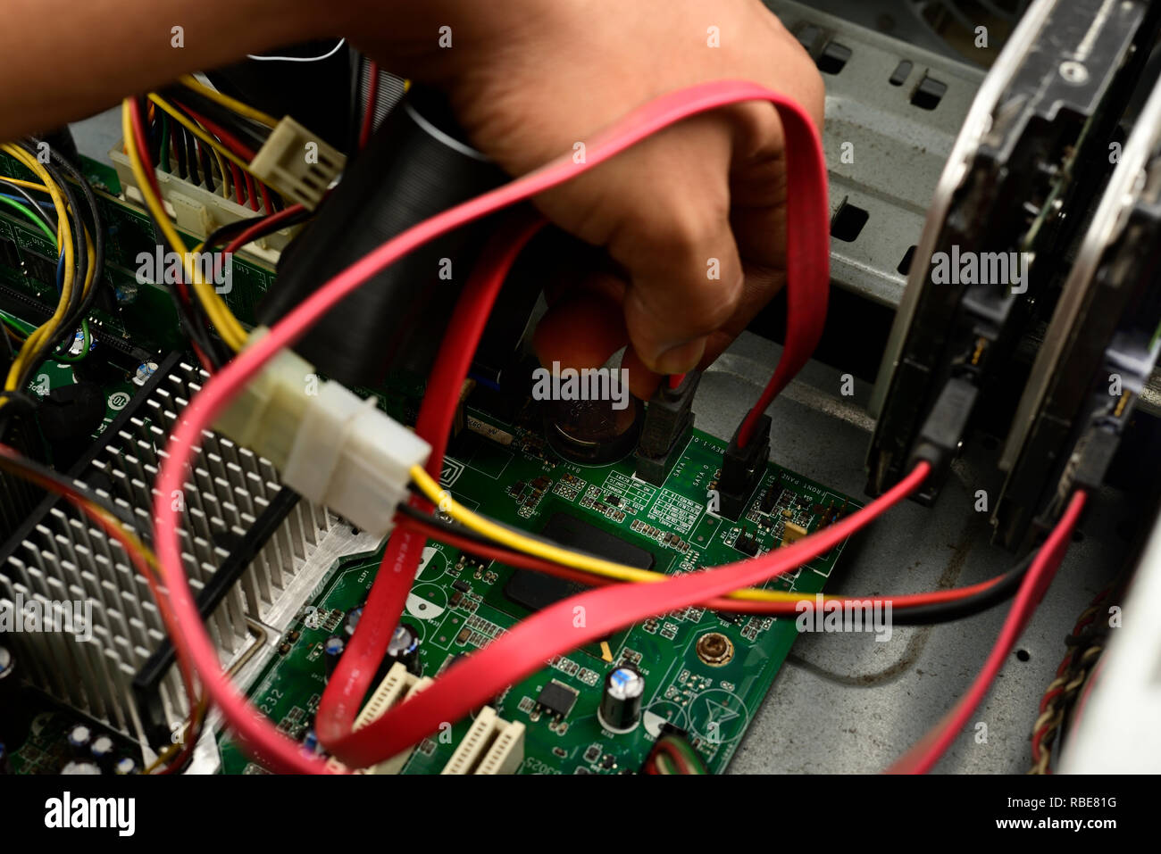Engineer is repairing electrical wire in a modern electrical equipment ...